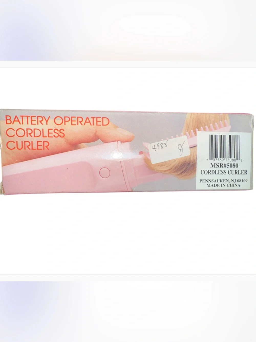 Vintage pink, portable battery-operated cordless hair curler and styling brush d